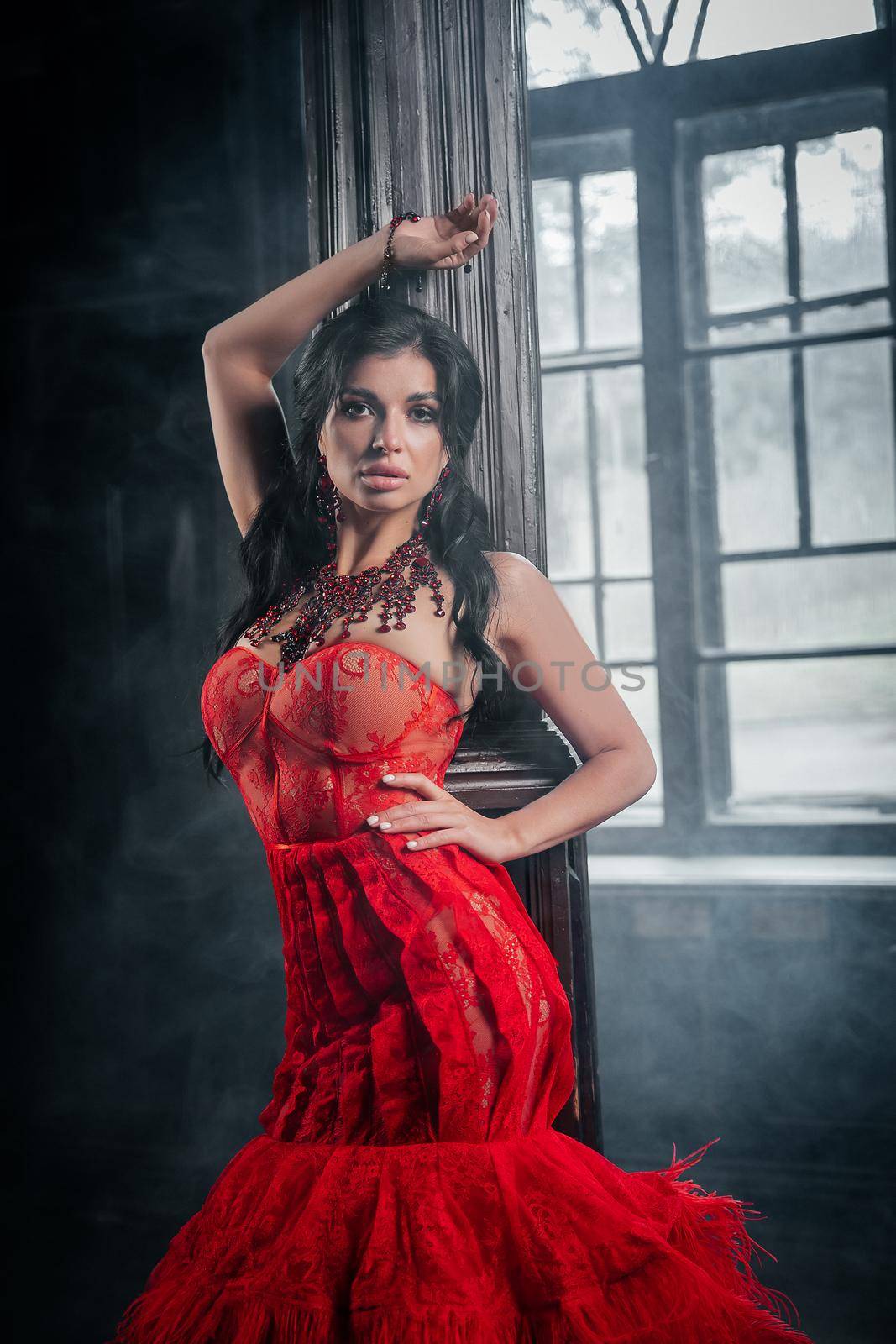 Woman Vintage Red Dress Old Castle Beautiful Princess In Seductive Dress Elegant Caucasian Female Fairy Tale story Near Big Window With Smoke Fog