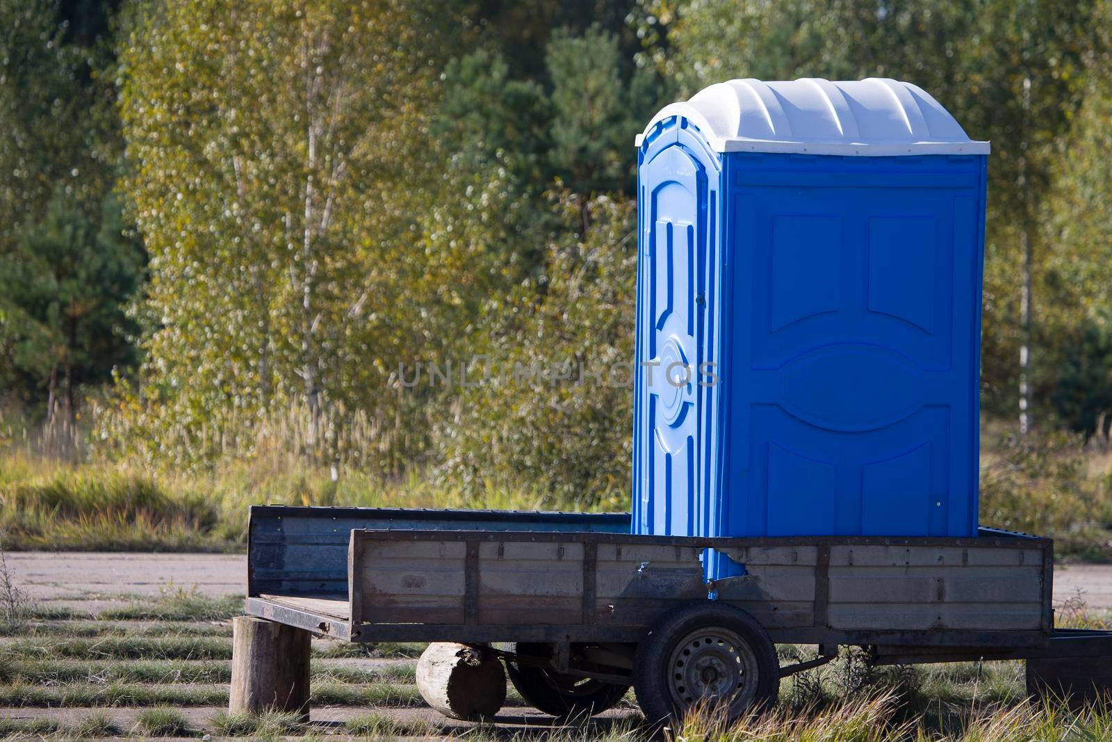 Mobile toilet. Temporary cabin toilet on a trailer in the woods