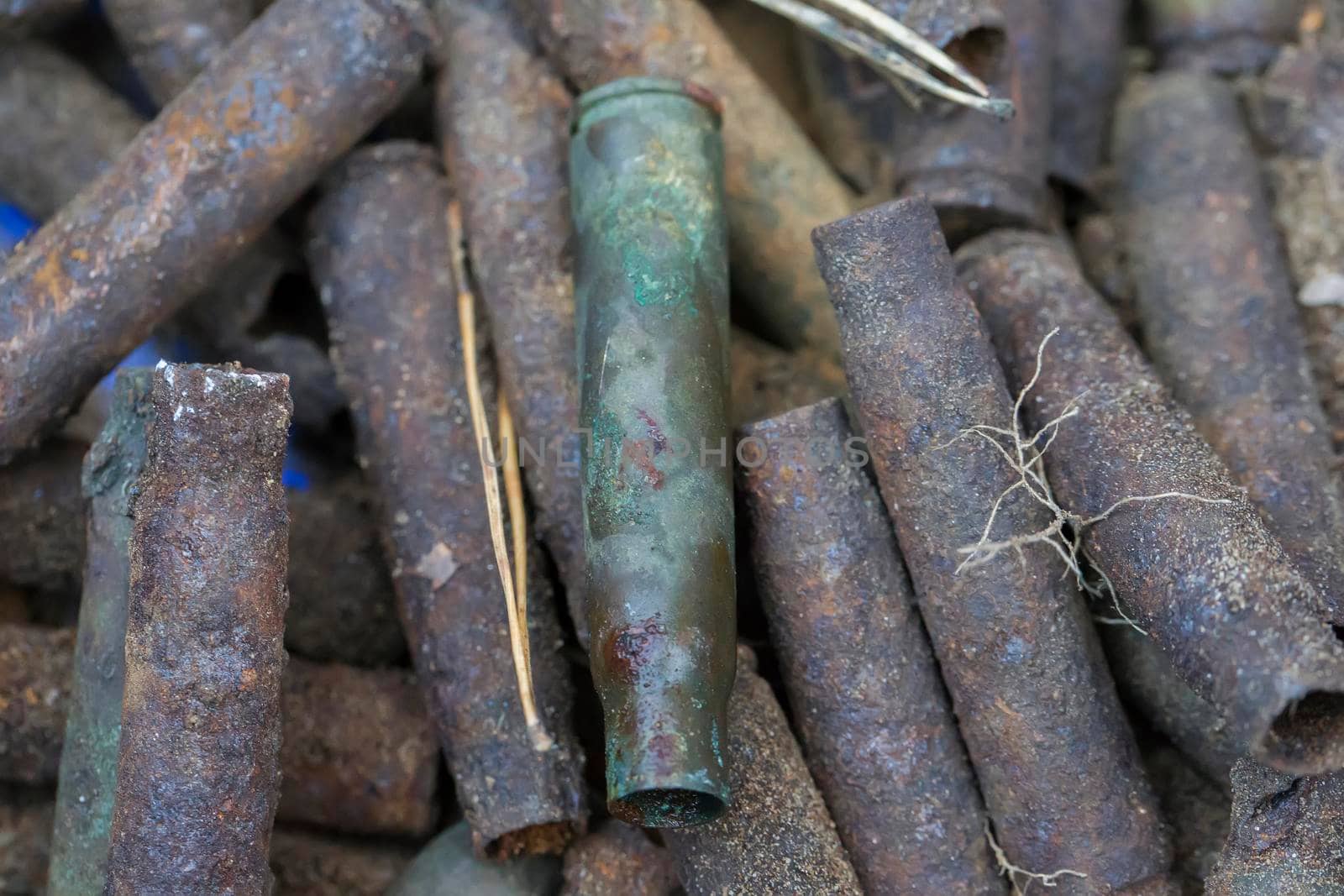 Old rusty military cartridges, sleeves