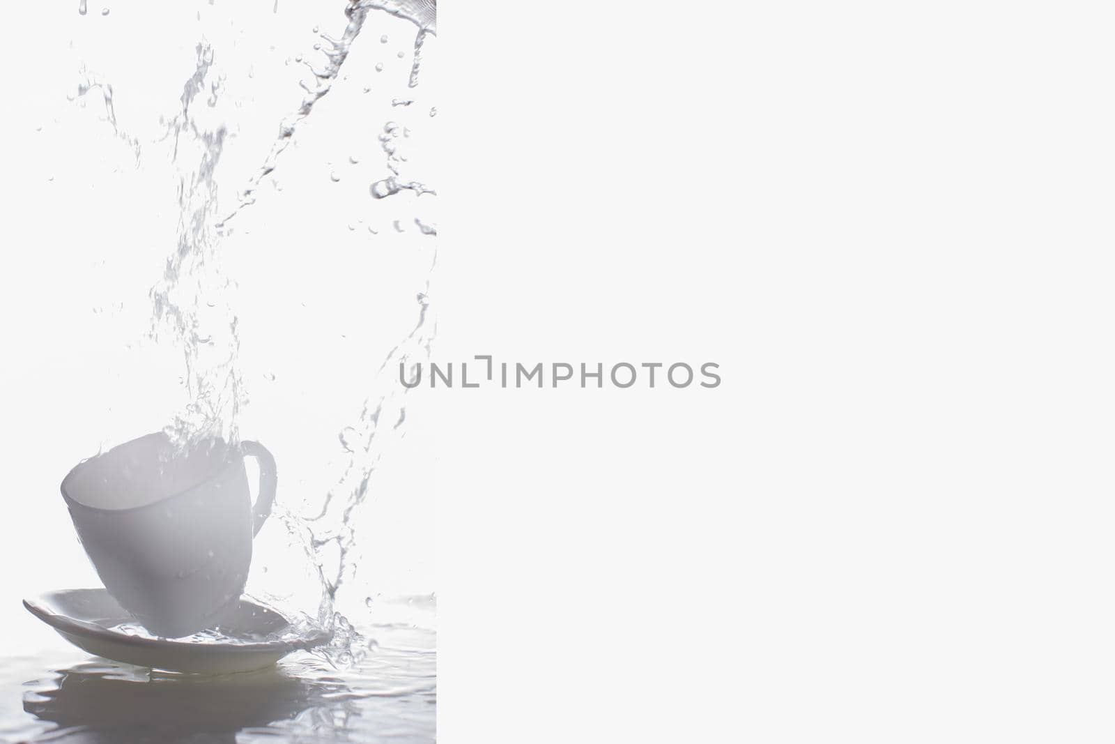 Business card with a cup and a spray of water