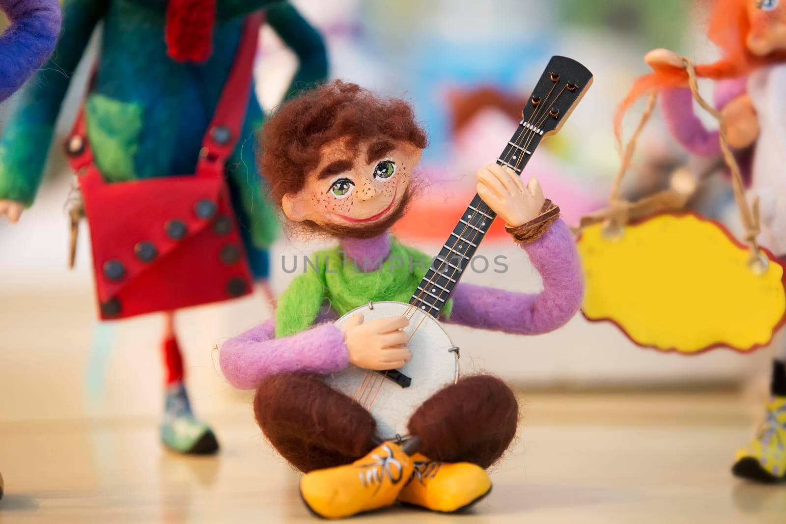 Belarus, Gomel, October 2, 2017. Central market. A figurine is a toy of a guitarist. Toys made of wool