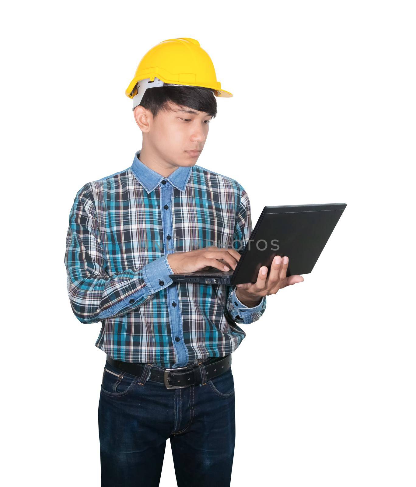 Engineer while holding using Laptop and head wear yellow safety helmet plastic . Concept Work construction on white background