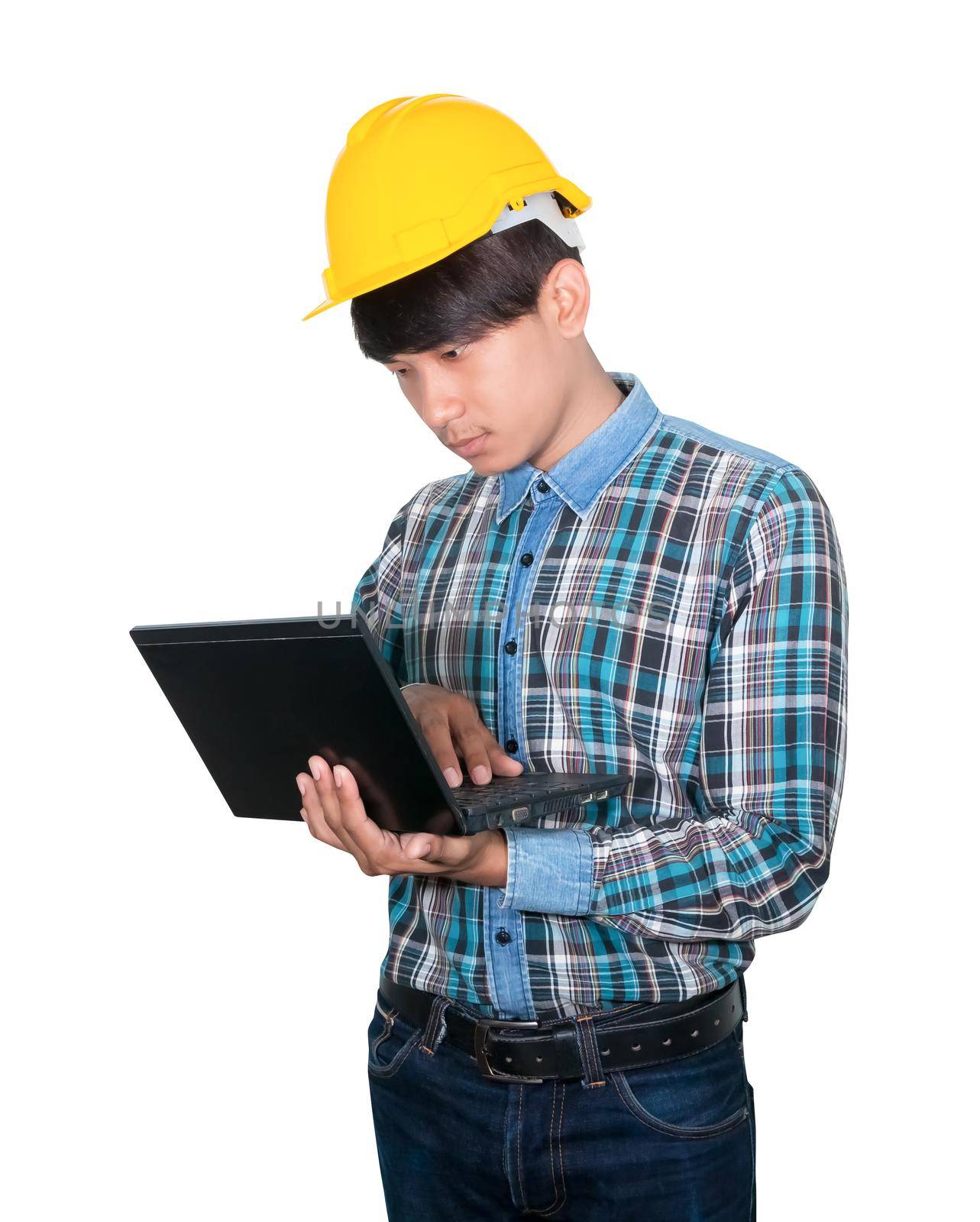Engineer while holding using Laptop and head wear yellow safety helmet plastic . Concept Work construction on white background by pramot