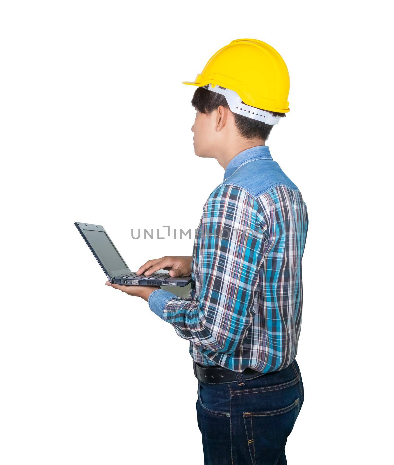 Engineer while holding using Laptop and head wear yellow safety helmet plastic . Concept Work construction on white background by pramot