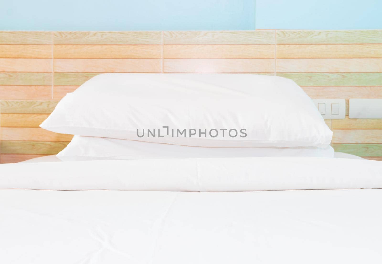 bed and  bedspread pillow white in in bedroom