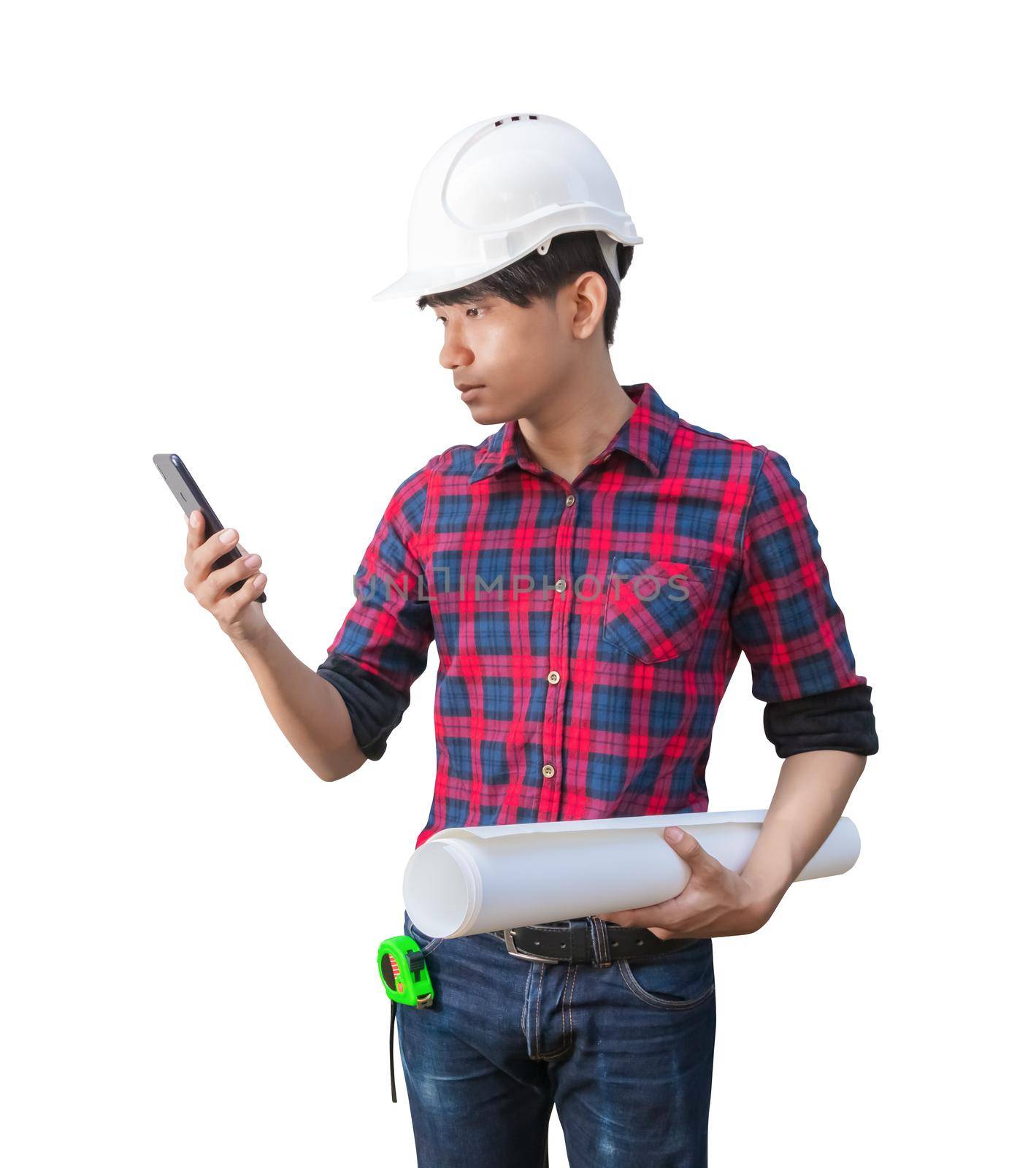 Engineer using cell phone with hand holding rolled blueprints and wear white safety helmet plastic on white background. construction concept by pramot