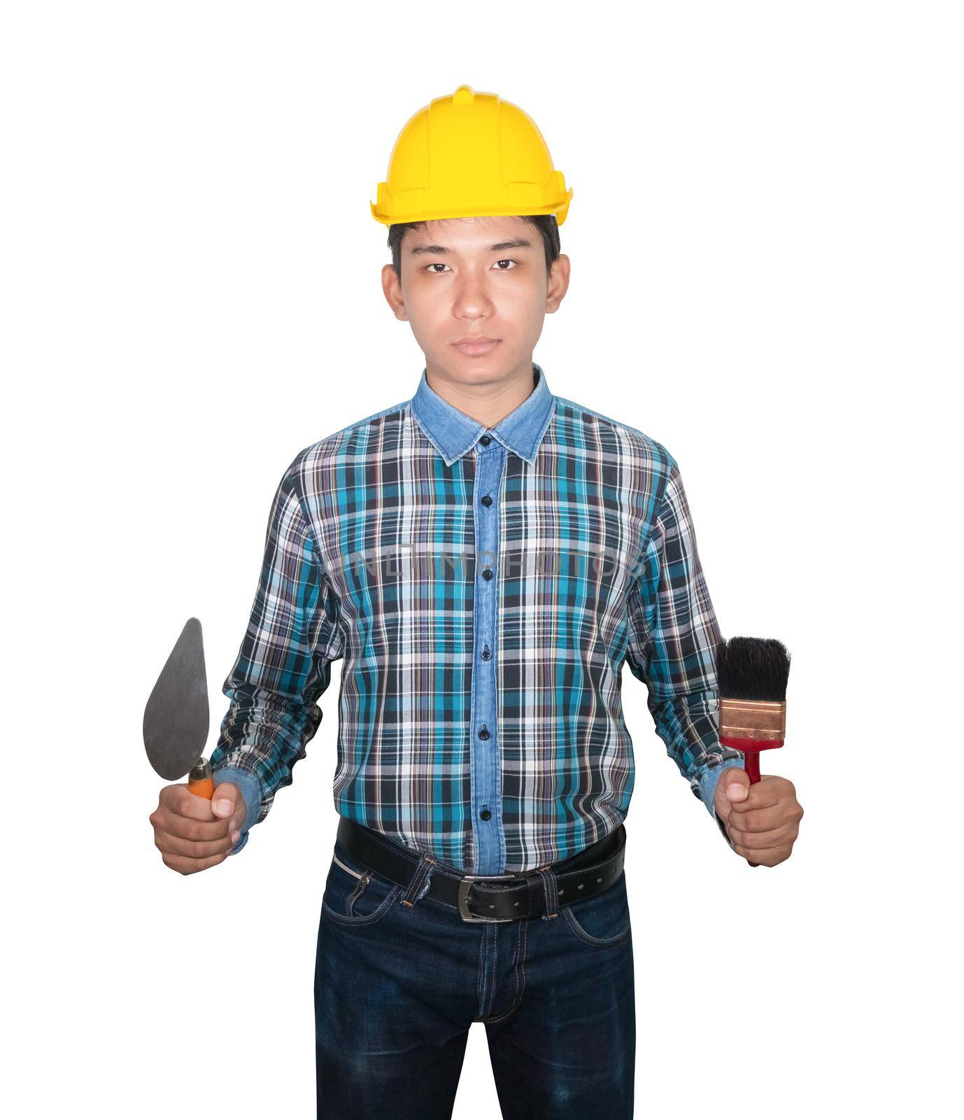 hand of engineer holding Triangle trowel and paint brush wear yellow safety helmet plastic on white background. construction concept