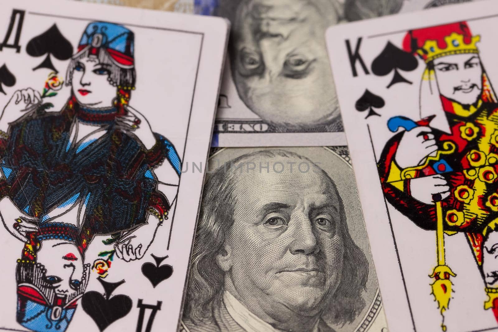 Dollars and playing cards close-up