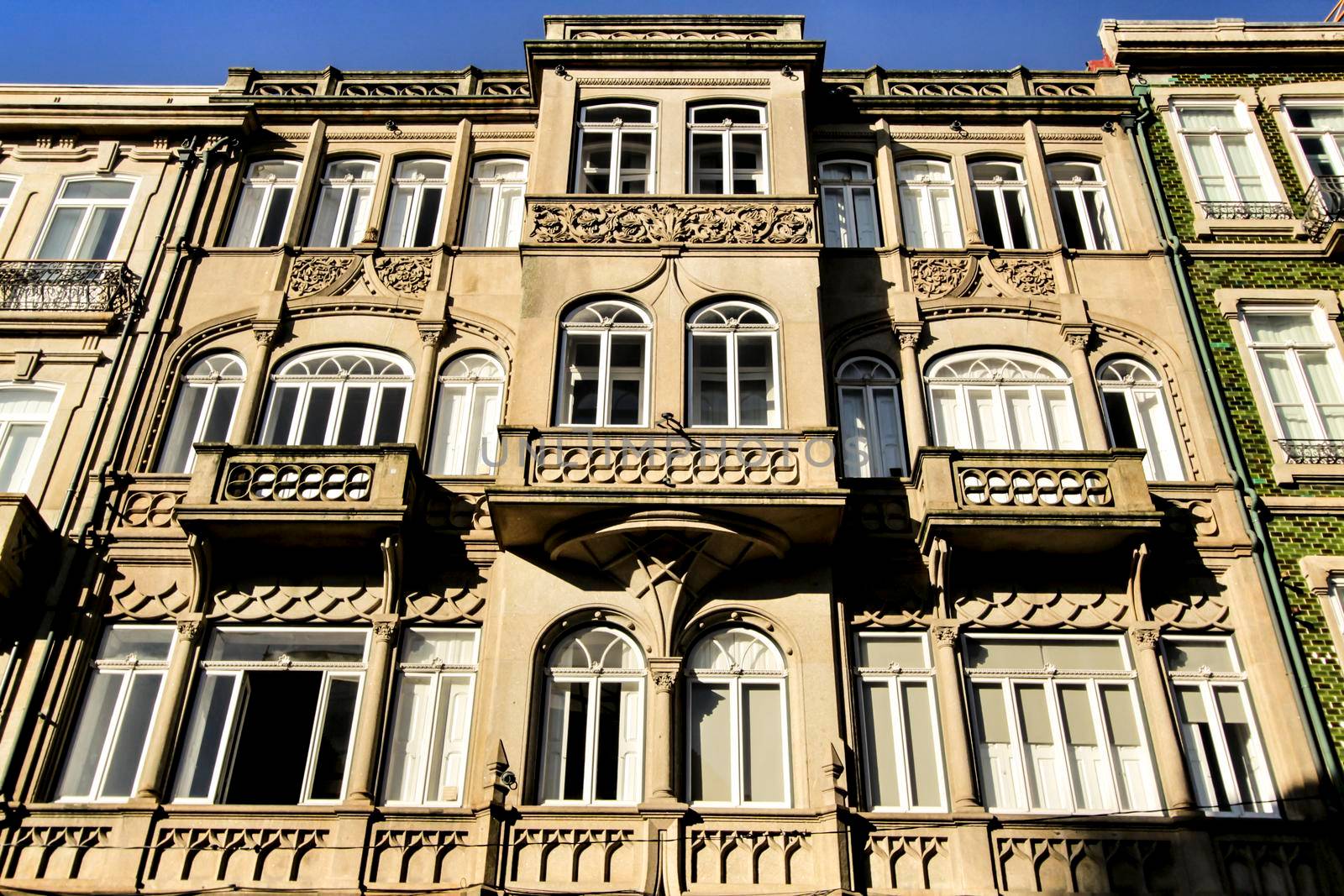 Beautiful and old colorful tiled facades in Porto city in January