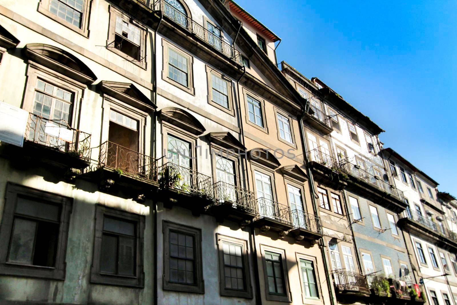 Beautiful and old colorful tiled facades in Porto city in January