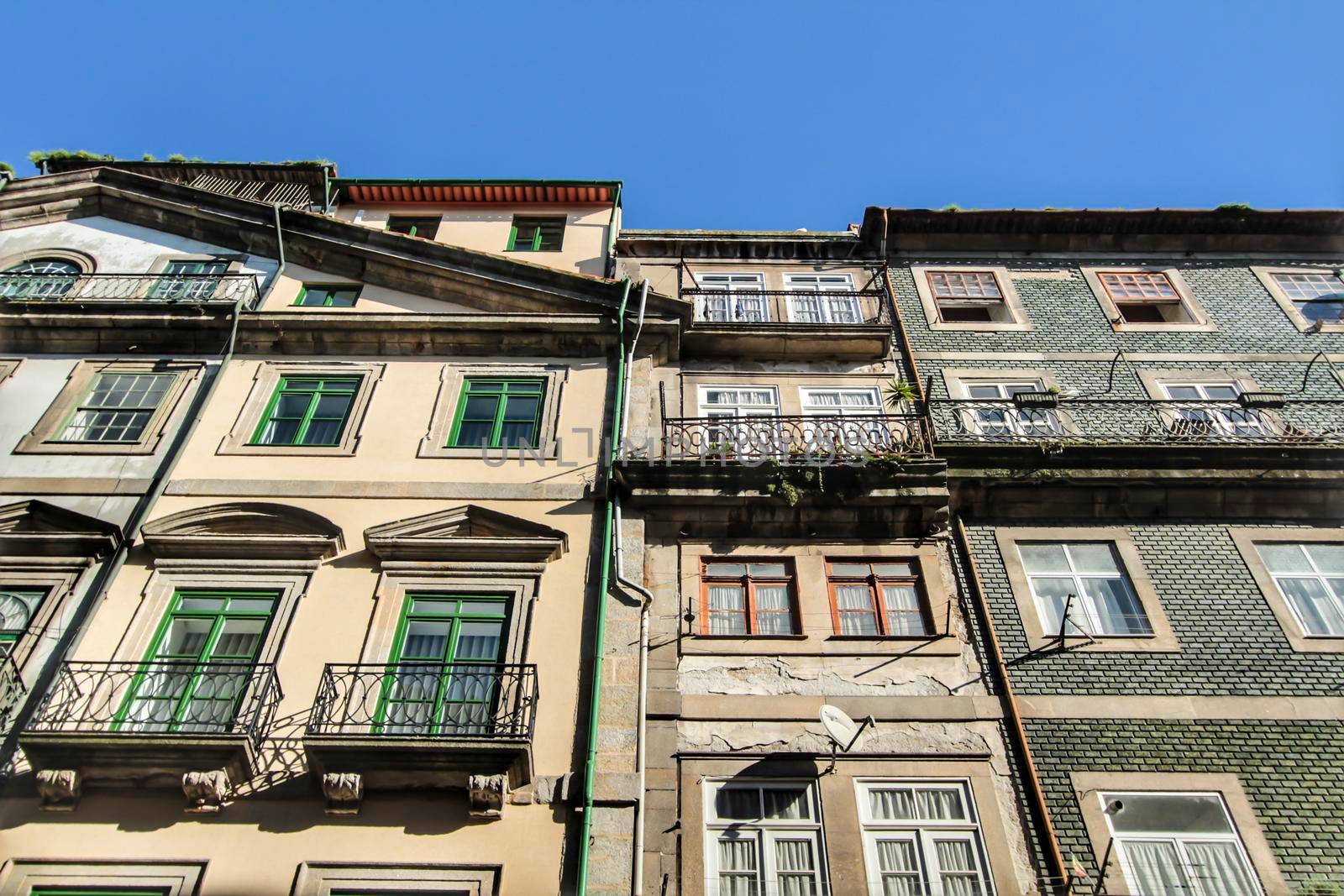Beautiful and old colorful tiled facades in Porto city in January