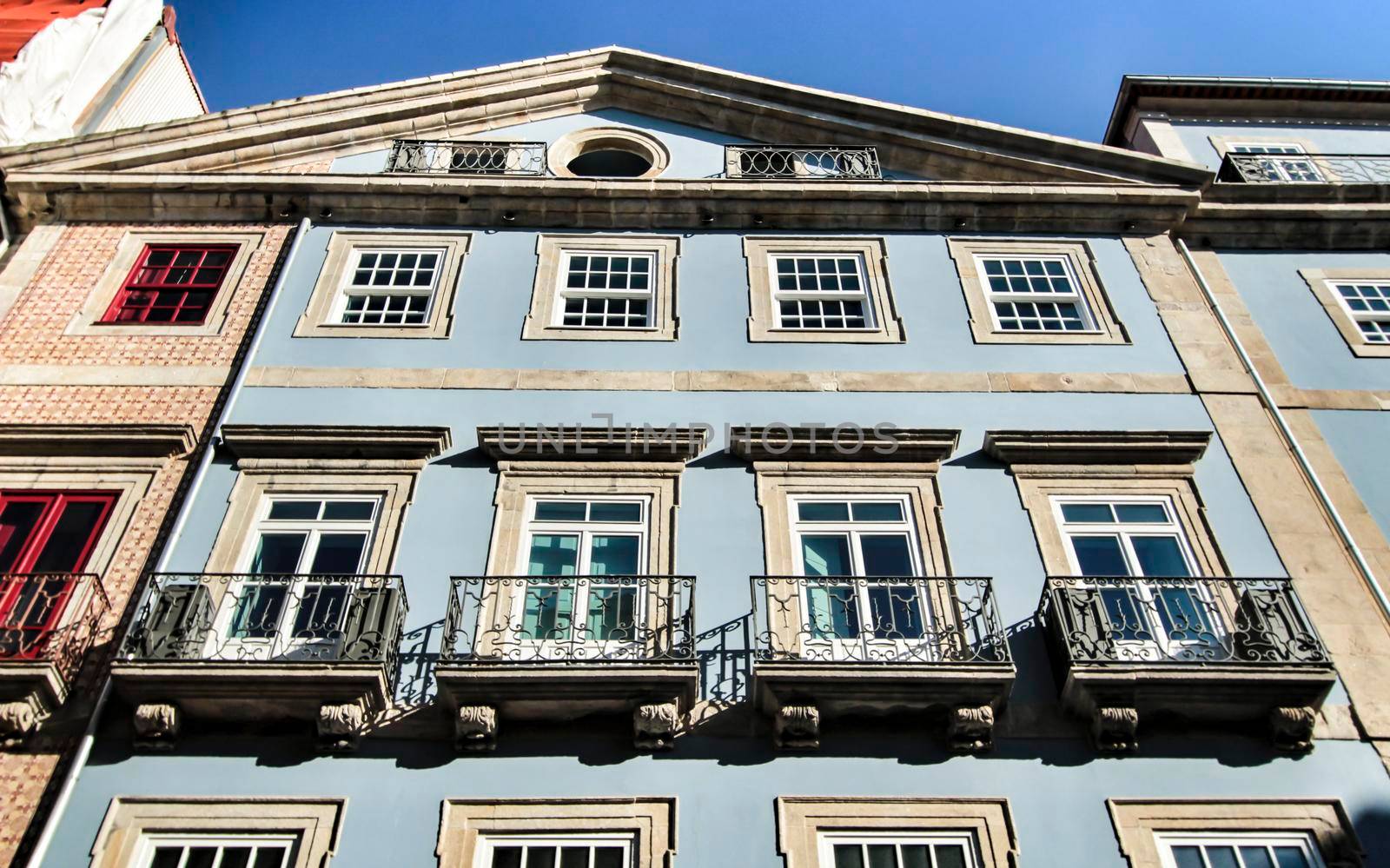 Beautiful and old colorful tiled facades in Porto city in January