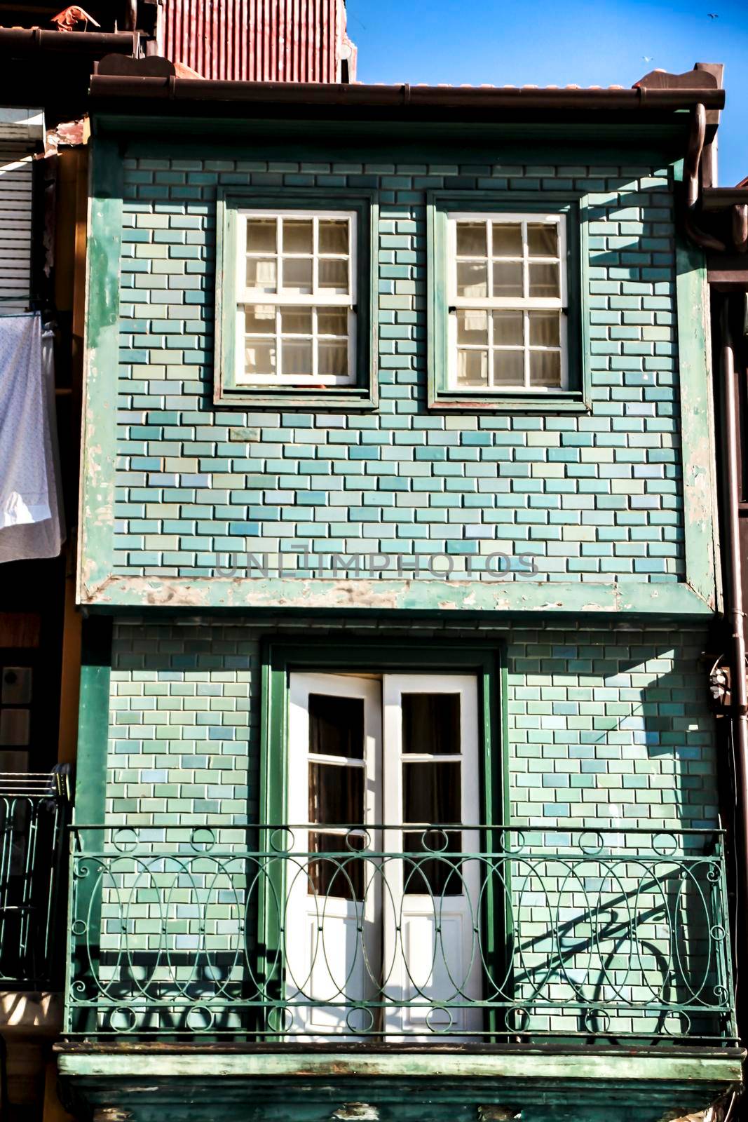 Beautiful and old colorful tiled facades in Porto city in January