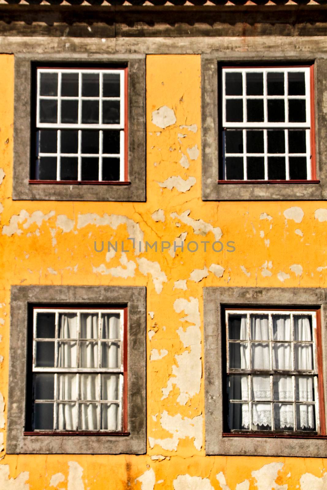 Beautiful and old colorful tiled facades in Porto city in January