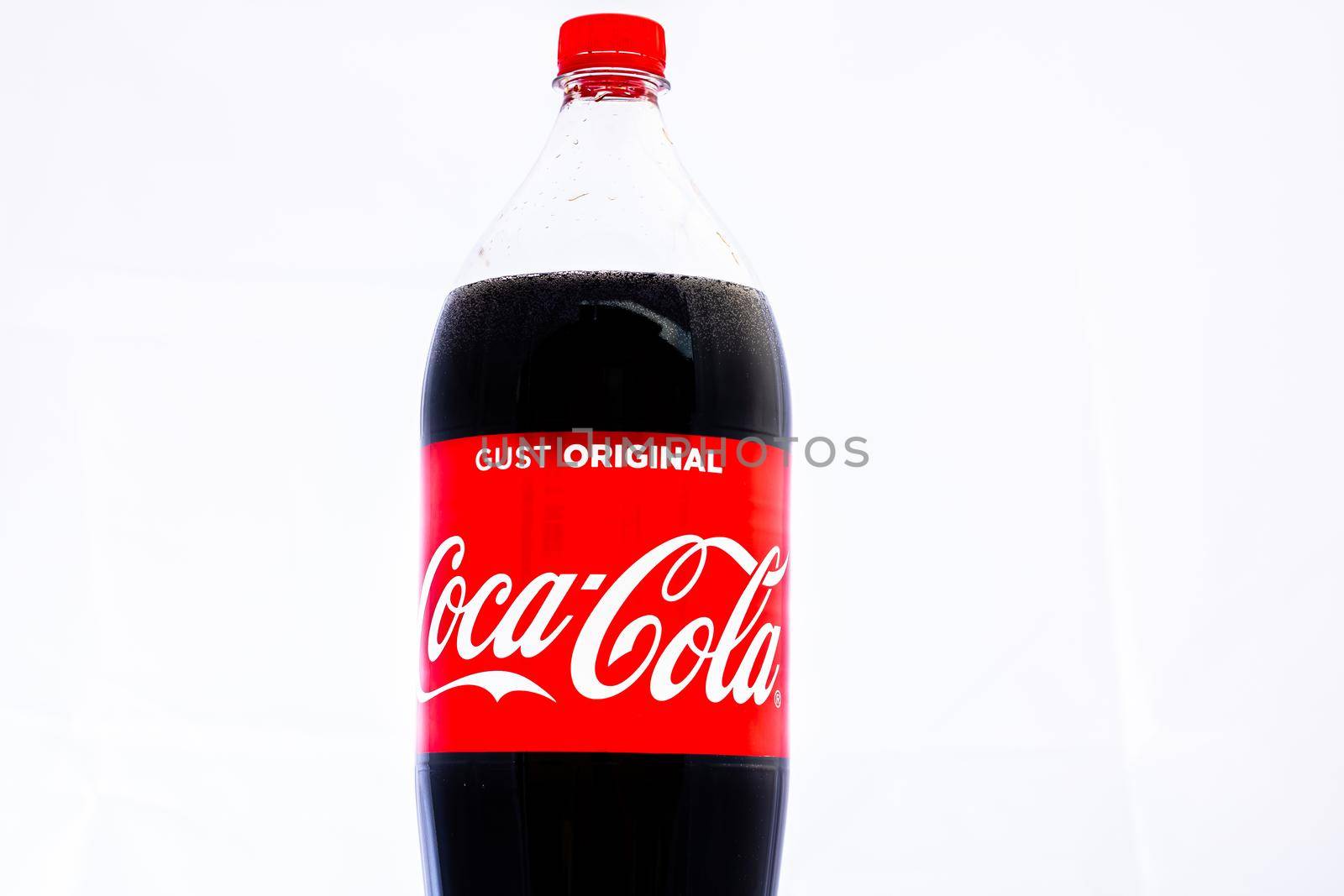 Coca-Cola plastic bottle Isolated on white background. Illustrative editorial photo shot in Bucharest, Romania, 2021