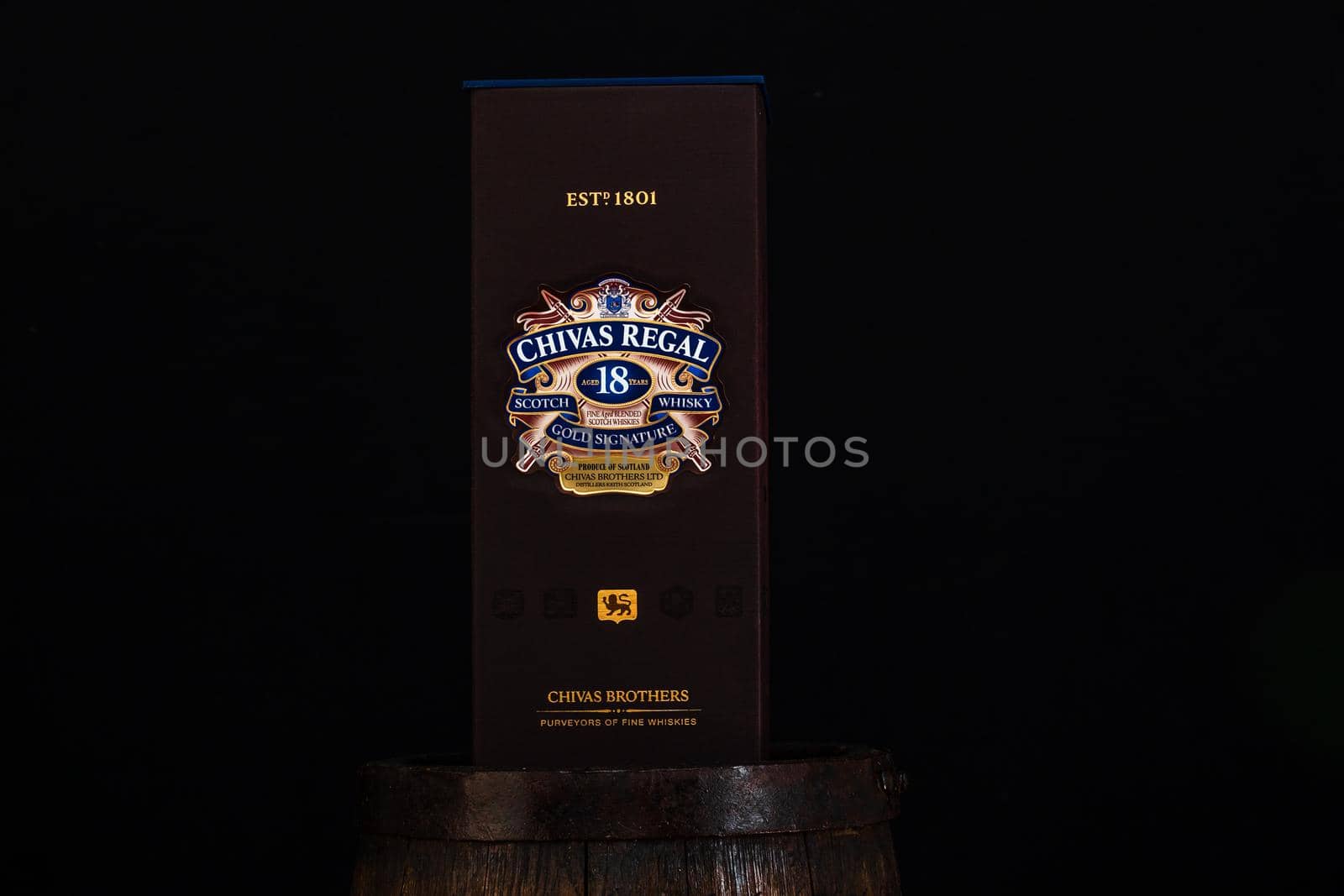 Chivas Regal 18 is blended from whiskies matured for at least 18 years. Whisky bottle on barrel. Illustrative editorial photo Bucharest, Romania, 2021 by vladispas