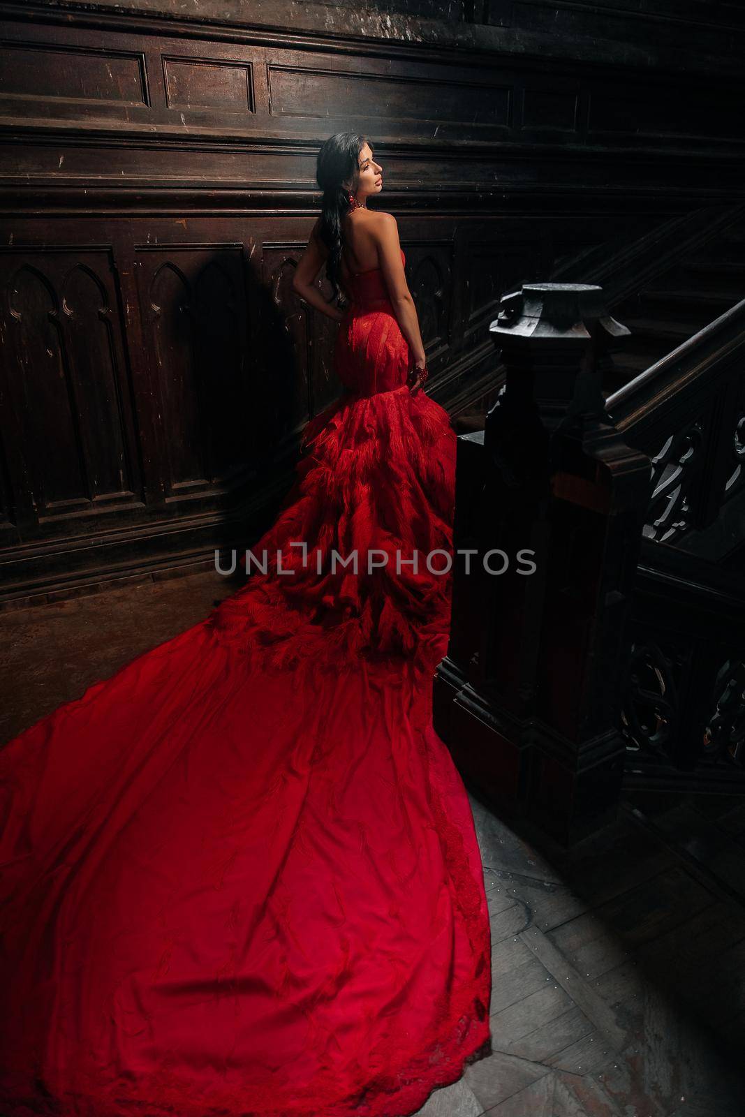 Woman Vintage Red Dress Old Castle Beautiful Princess In Seductive Dress Elegant Caucasian Female Fairy Tale story Dark Stairs