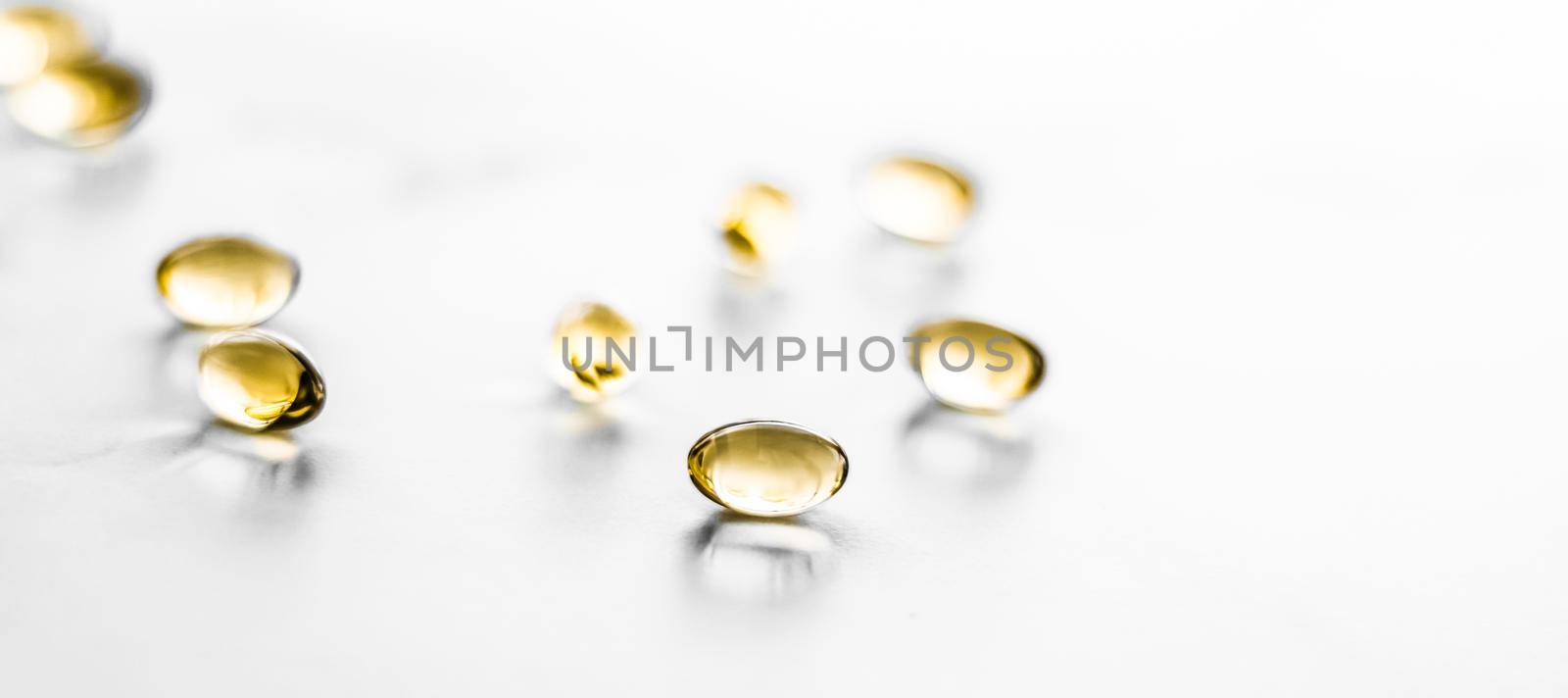 Pharmaceutical, branding and science concept - Vitamin D and golden Omega 3 pills for healthy diet nutrition, fish oil food supplement pill capsules, healthcare and medicine as pharmacy background