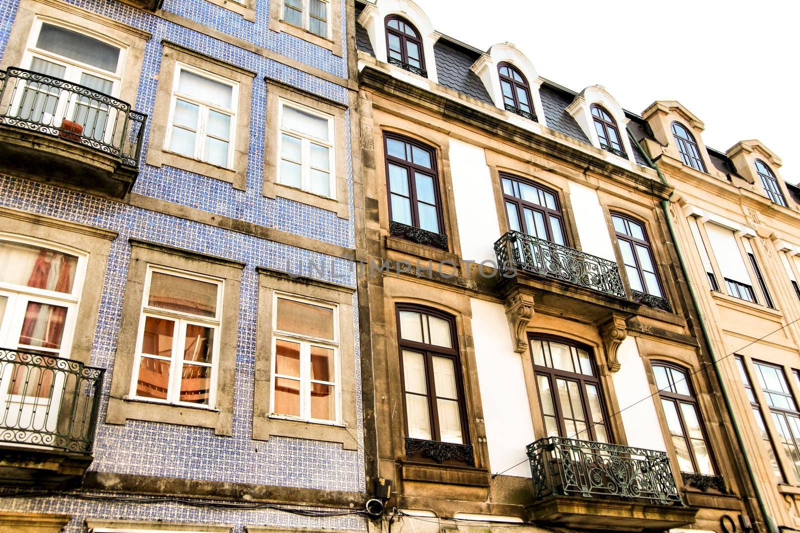 Beautiful and old colorful tiled facades in Porto city in January