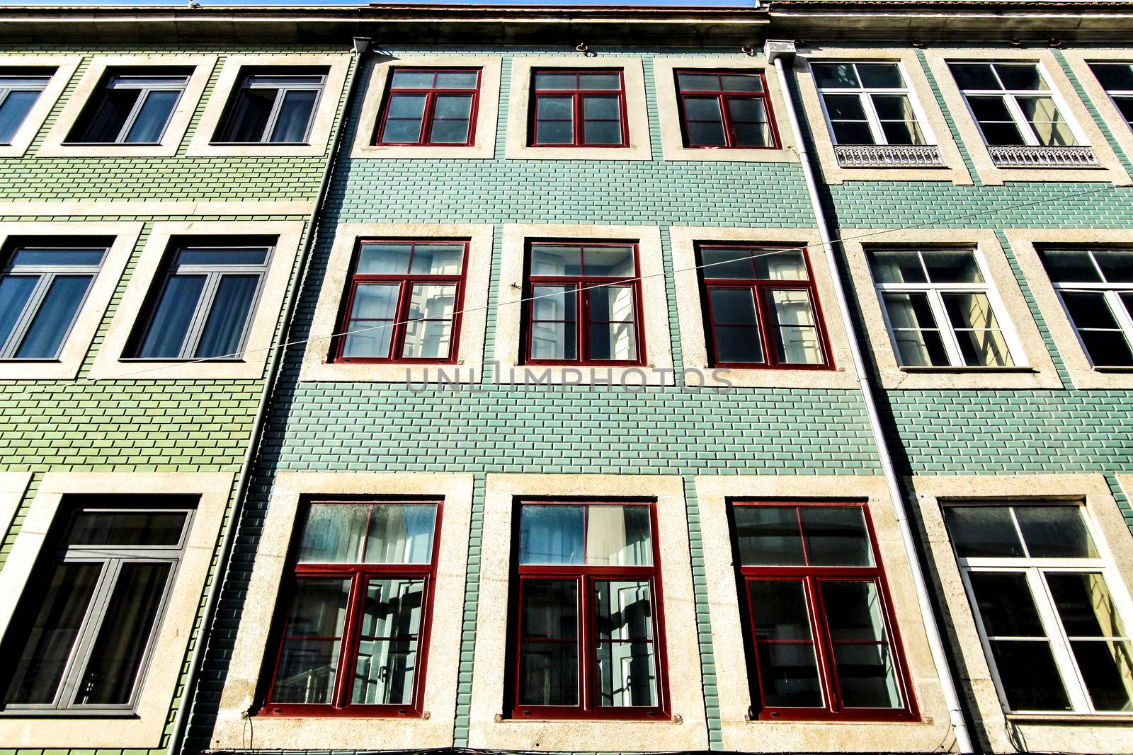 Beautiful and old colorful tiled facades in Porto city in January