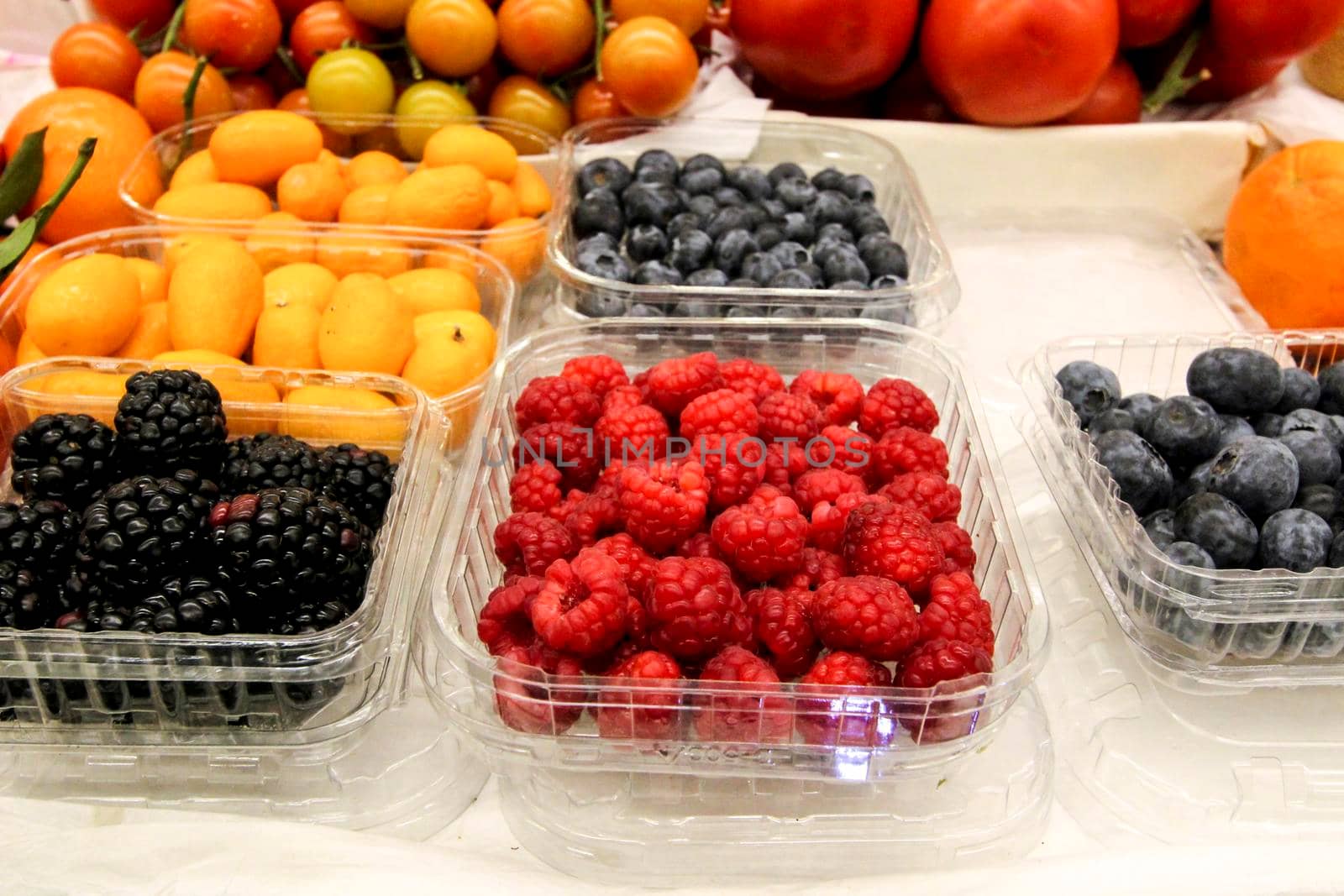 Colorful and tasty tropical Fruits for sale at a market stall at the provisional market of Bolhao in Oporto