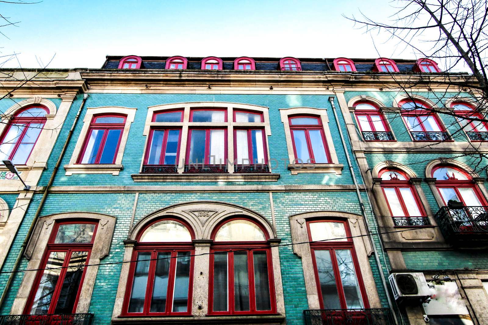 Beautiful and old colorful tiled facades in Porto city in January