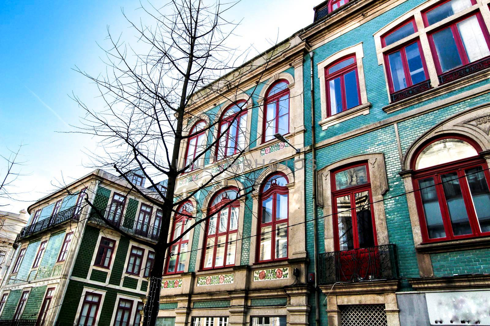 Beautiful and old colorful tiled facades in Porto city in January