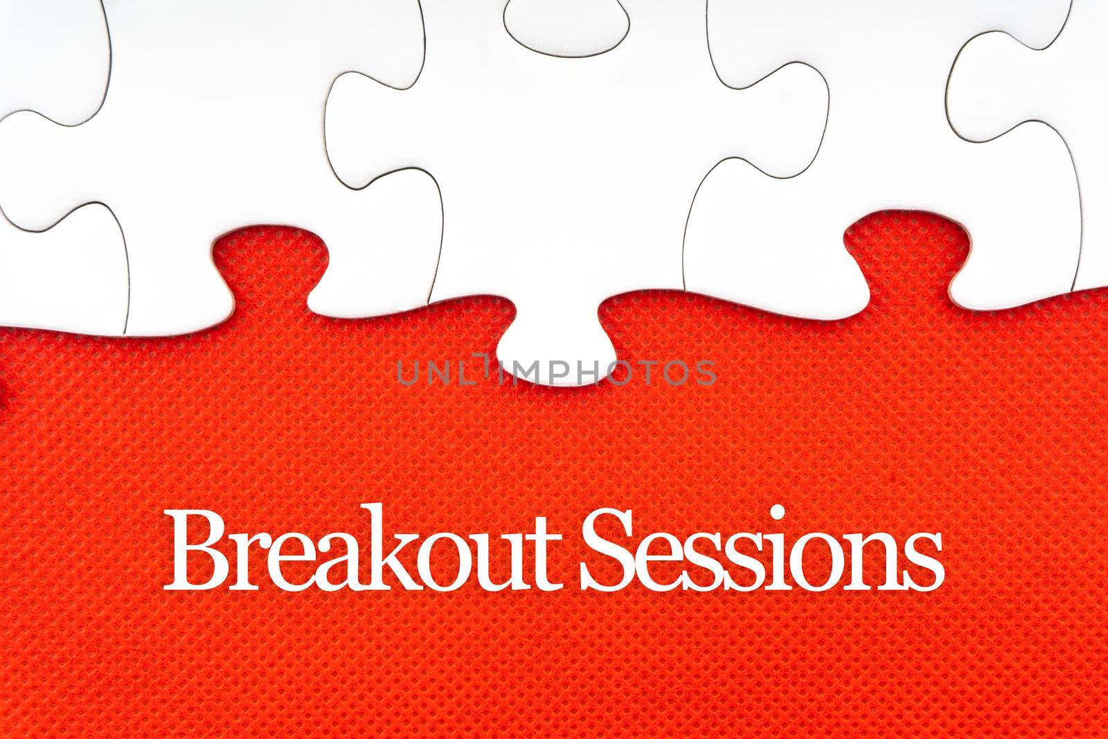 BREAKOUT SESSIONS text with jigsaw puzzle on red background. by silverwings