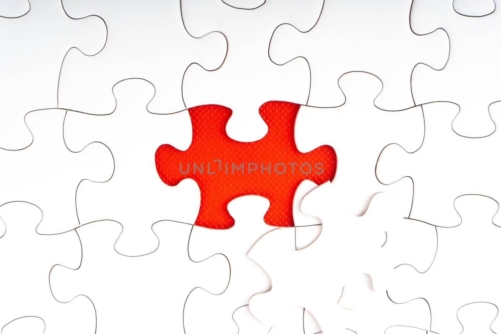 Jigsaw puzzle pieces on red background.  by silverwings