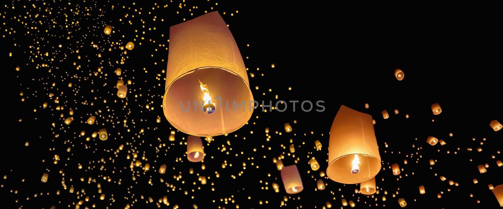 Tourist floating sky lanterns in Loy Krathong festival , Chiang Mai ,Thailand.