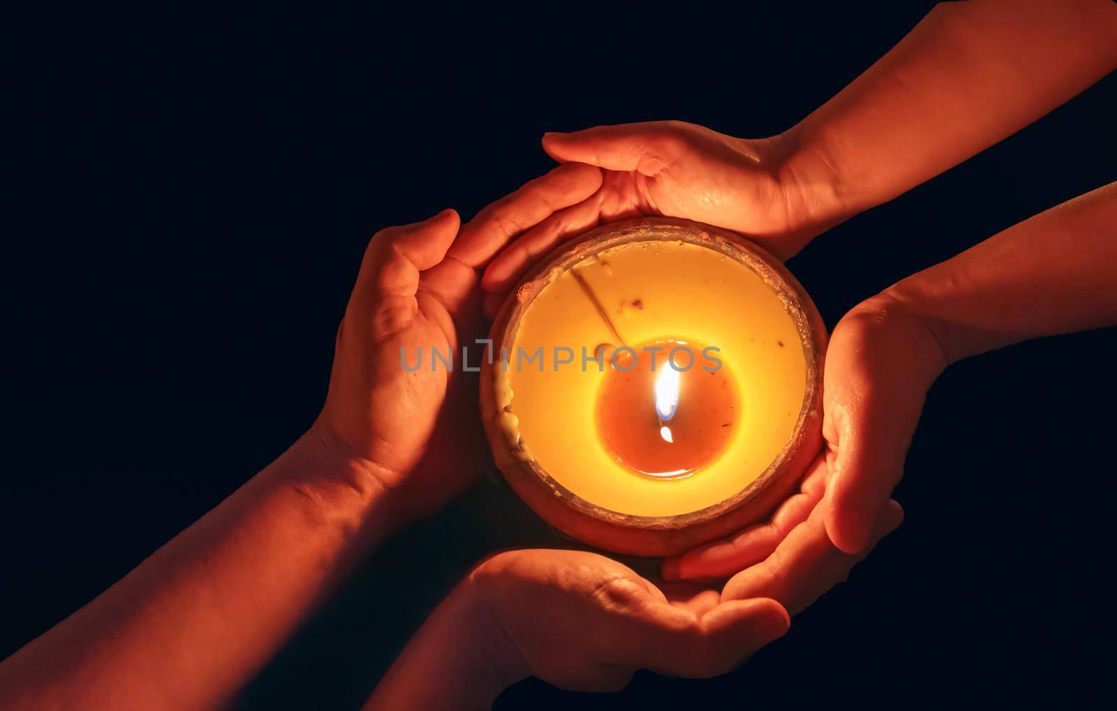 Candle in the hands blessing together