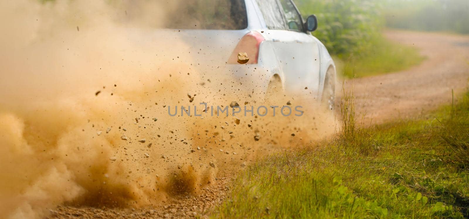 Gravel splashing from rally car drift on dirt track by toa55