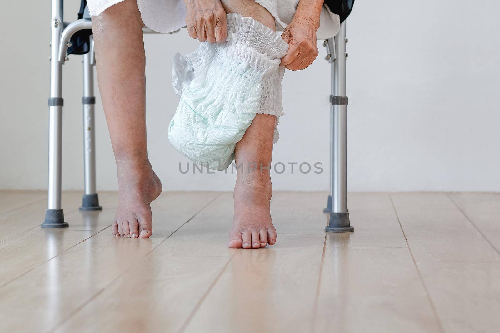 elderly woman changing diaper