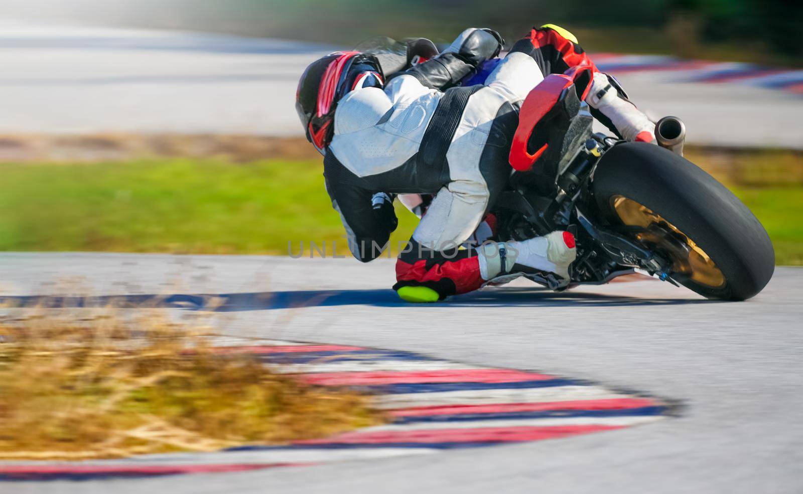 Motorcycle leaning into a fast corner on race track by toa55