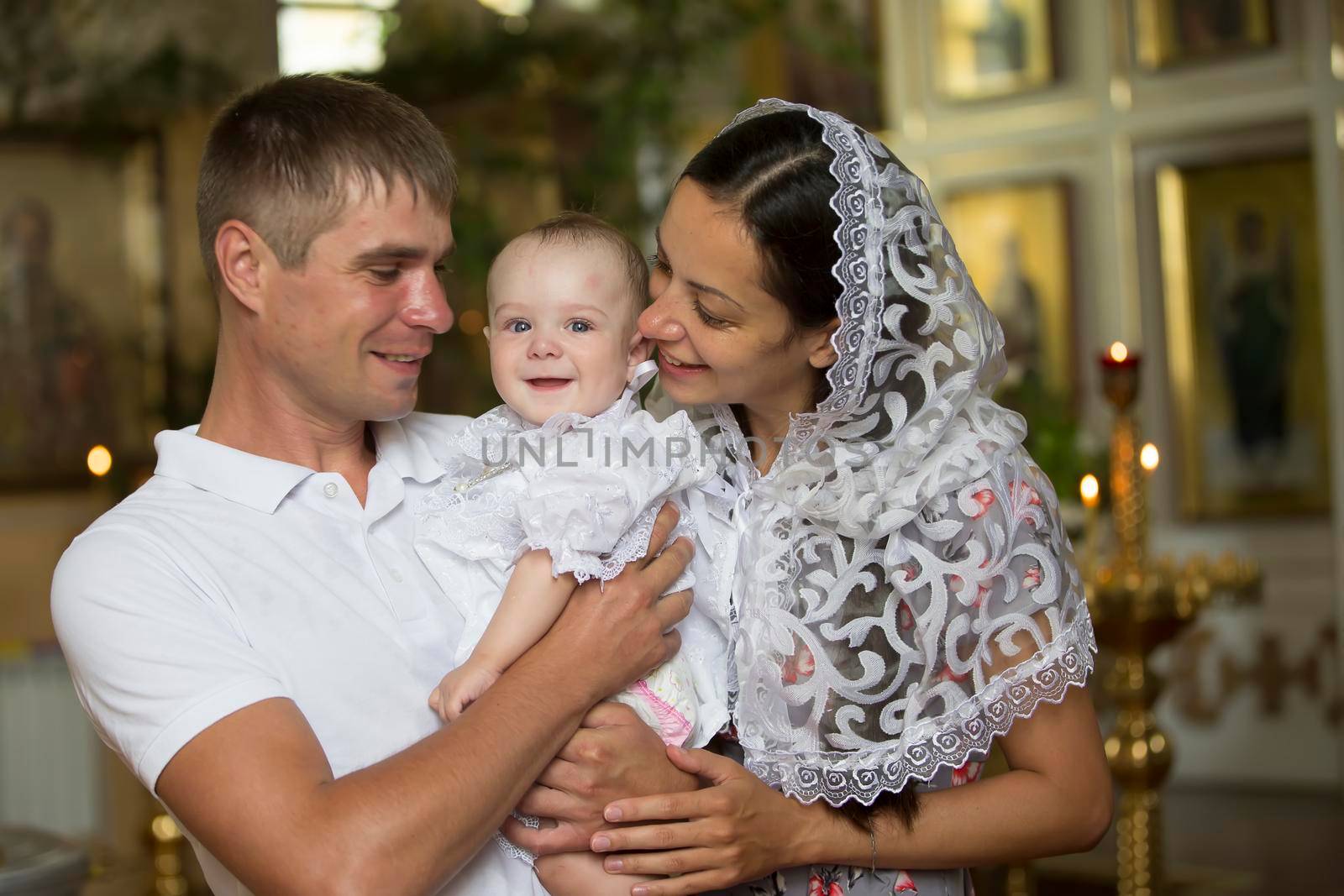 Belarus, the city of Gomil, June 20, 2019. City church.Family with baby in church. Parents with a child in an Orthodox church