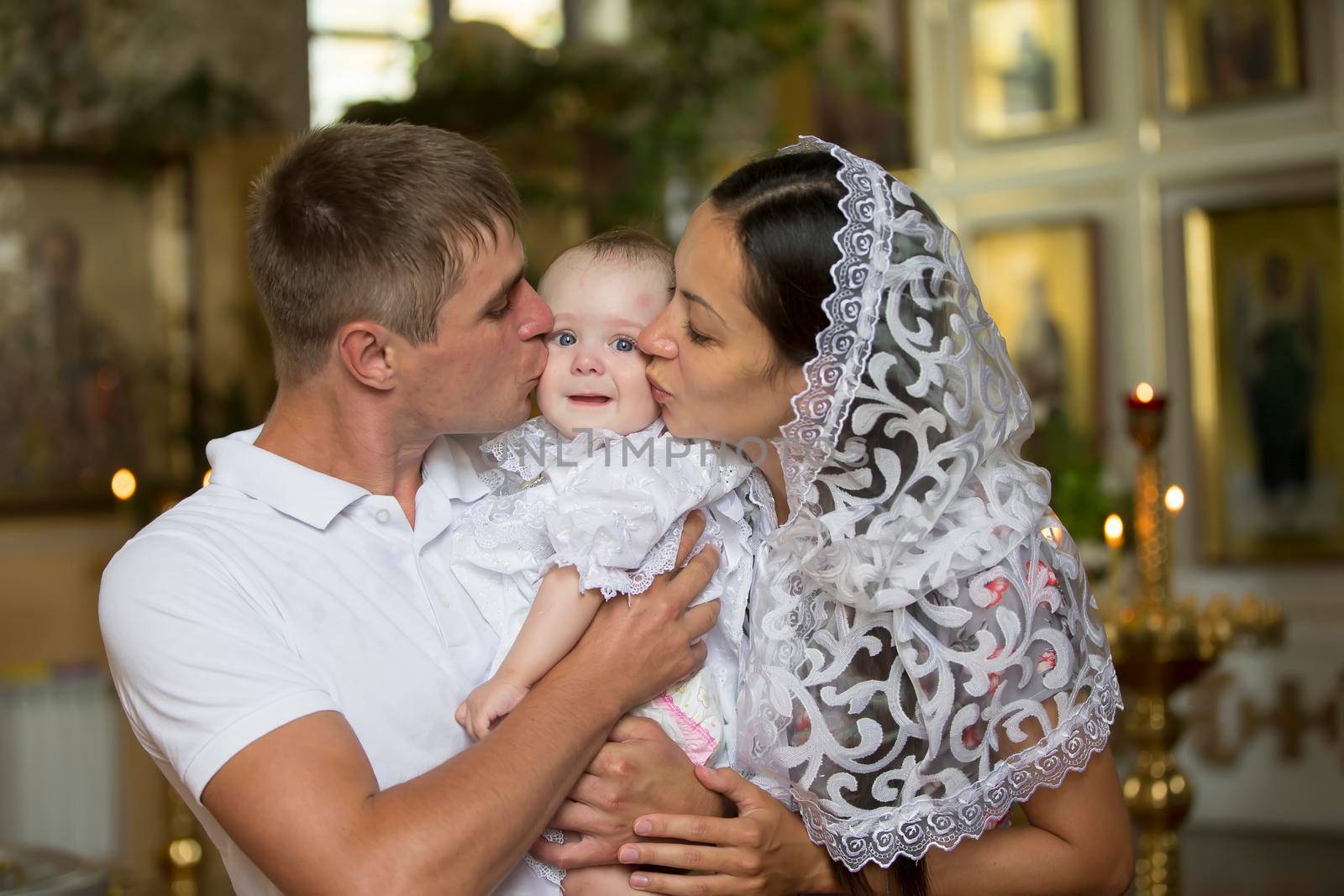 Belarus, the city of Gomil, June 20, 2019. City church.Family with baby in church. Parents with a child in an Orthodox church