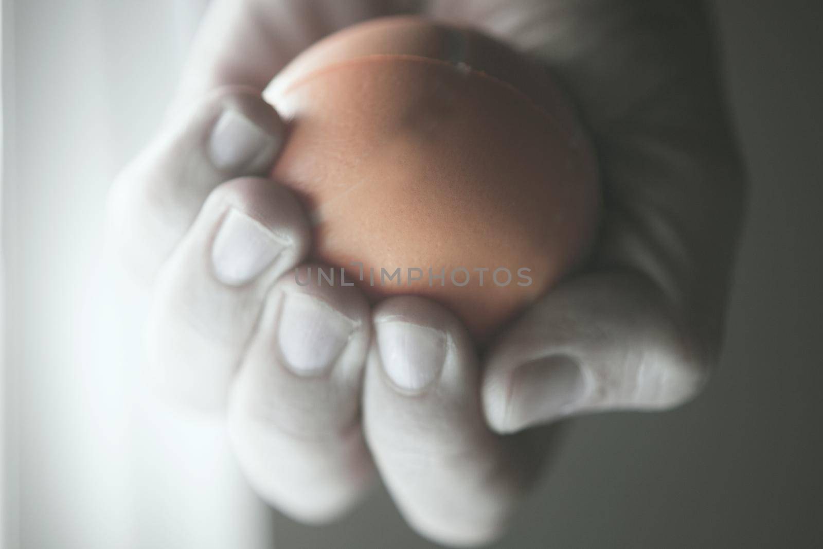 Exercises with one hand and yellow physiotherapy ball