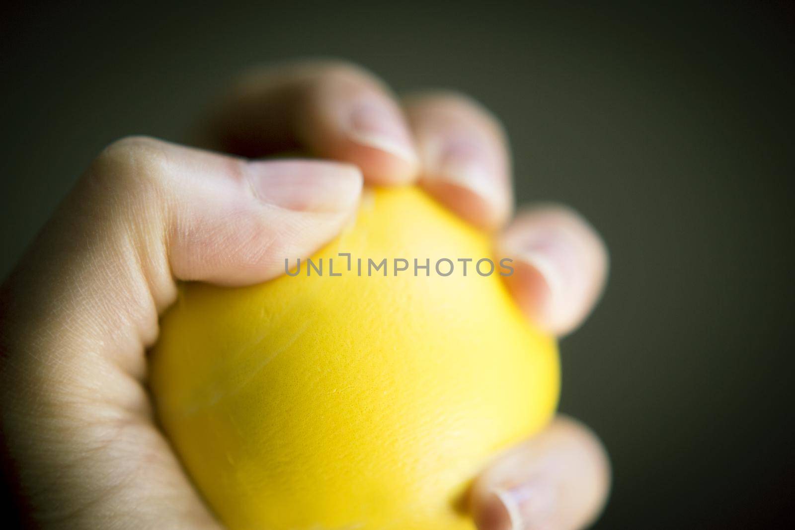 Exercises with one hand and yellow physiotherapy ball