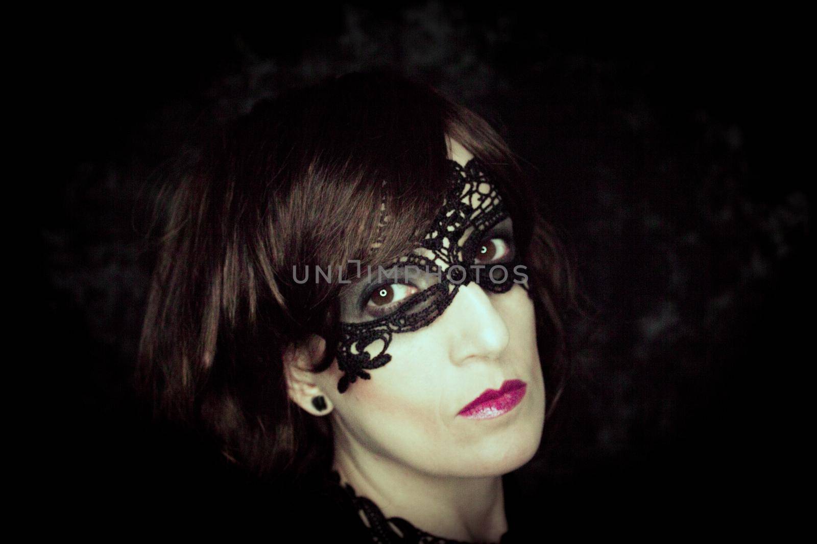 Woman disguised in gothic style for halloween party with mask