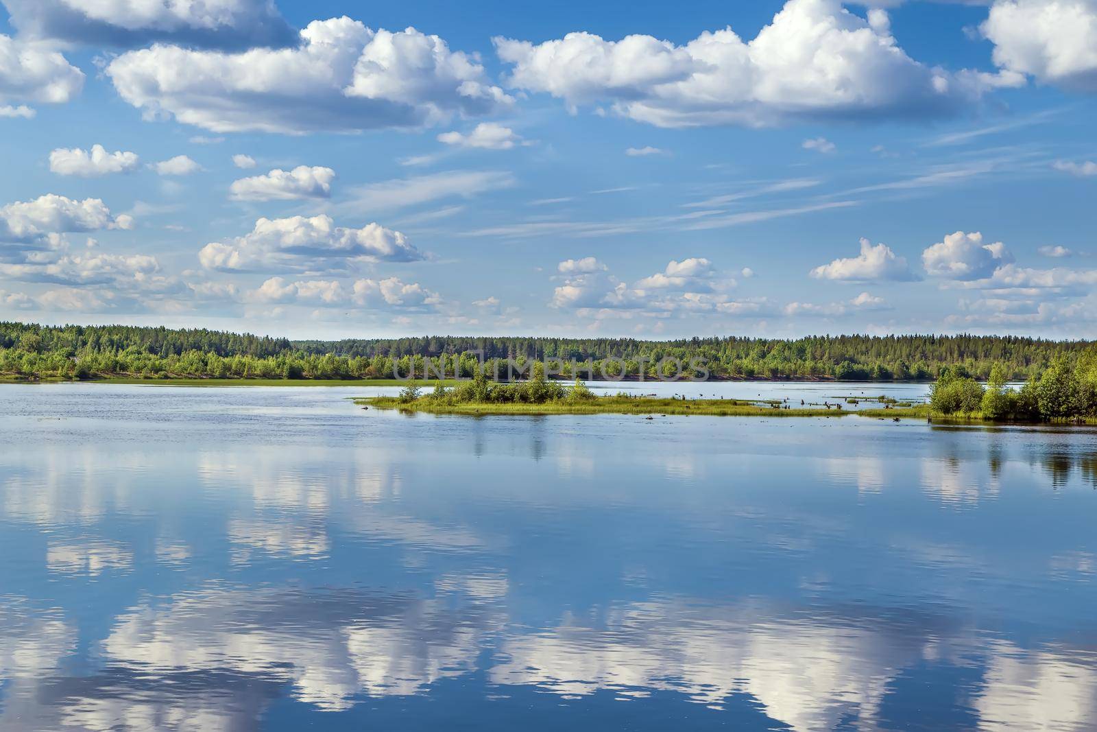 Landscape with a symmetrical reflection on the Vyg river (part of the White Sea-Baltic Canal), Russia