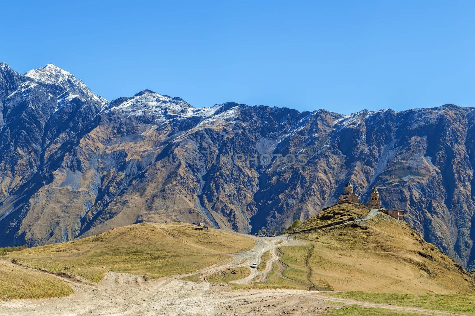 Landscape with Gergeti Trinity Church and mountains, Georgia