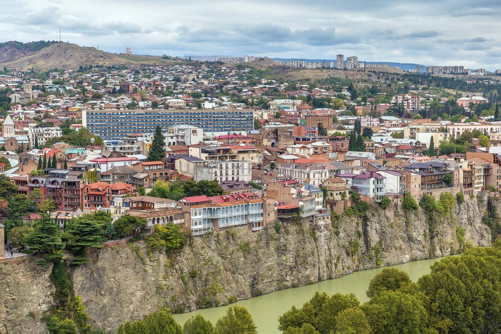 Houses with balconies on a cliff above the Kura River, Tbilisi, Georgia