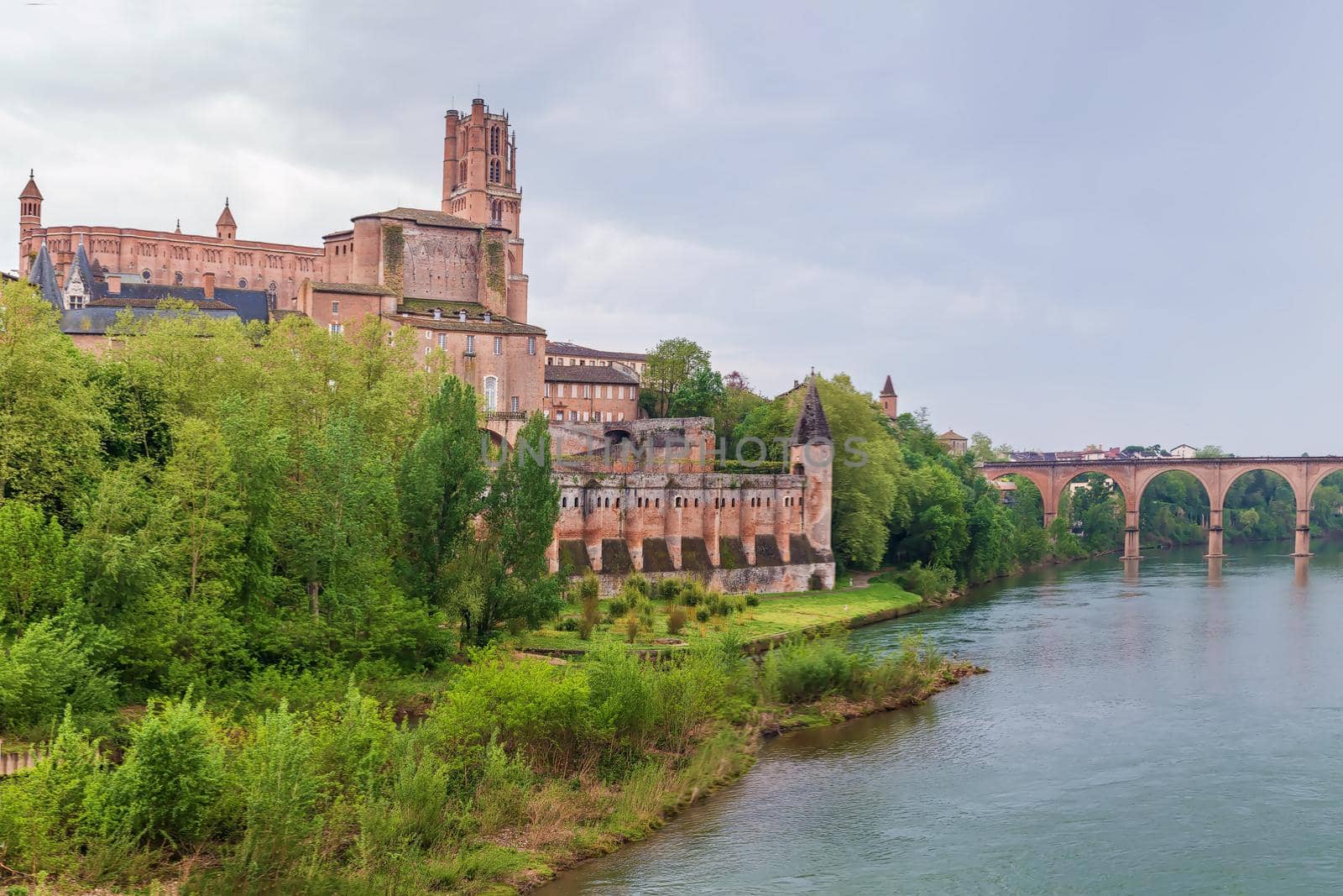 view of Tarn river in Albi with cathedral and bridge, France
