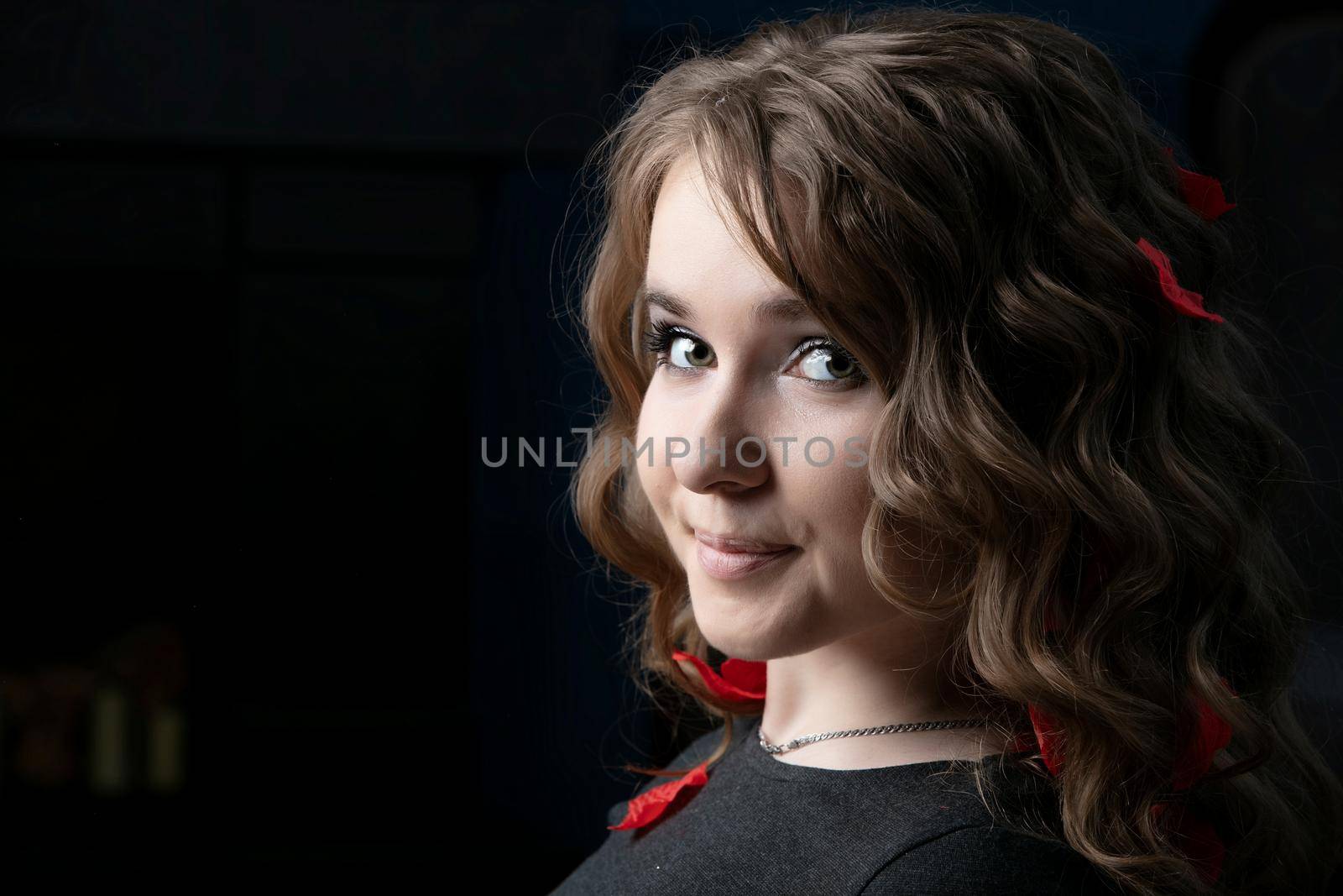 Portrait of a twenty year old girl with long hair and blue eyes. Young European.