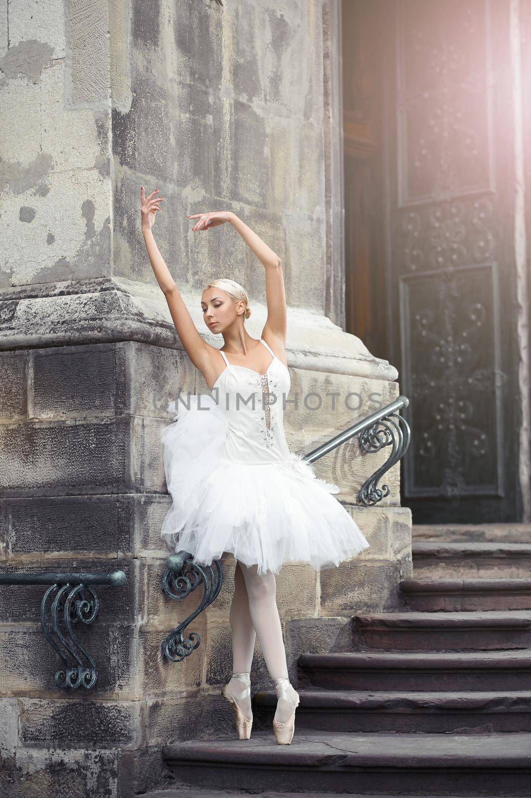 Beautiful ballerina dancing near an old building by SerhiiBobyk