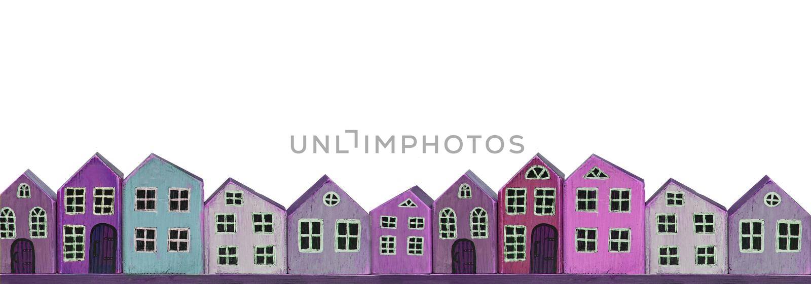 Wooden toy purple houses on a white background. Banner miniature town. by Sviatlana
