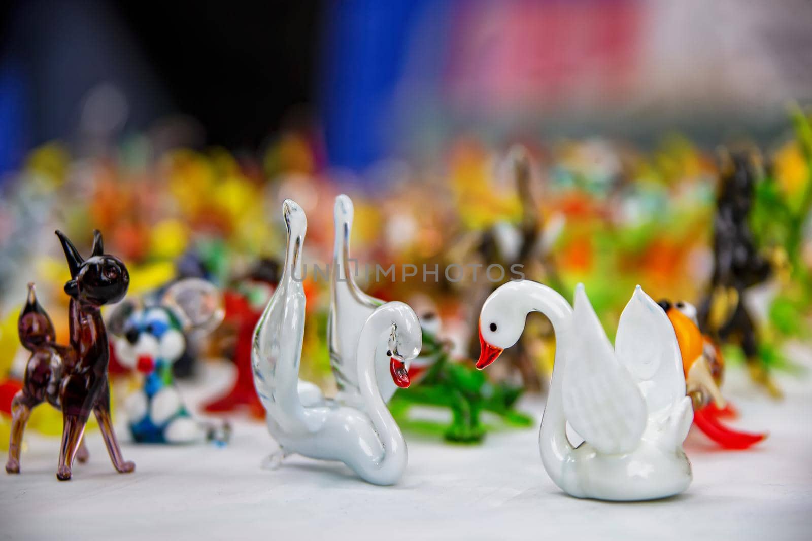 Beautiful glass figurines. Glass swans. Artificial swans.