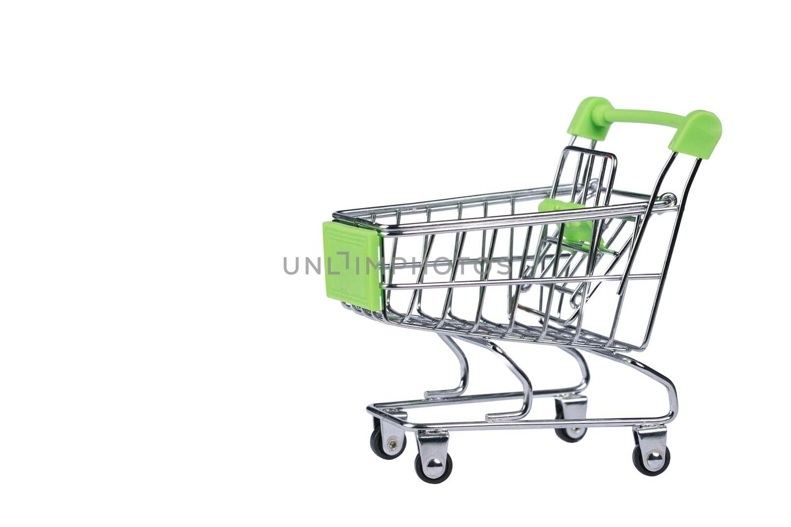 Miniature supermarket trolley on a white background.