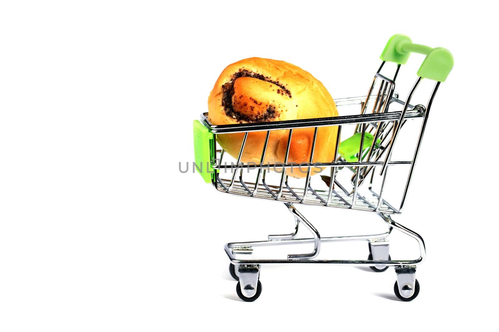 Miniature supermarket trolley with a bun on a white background.