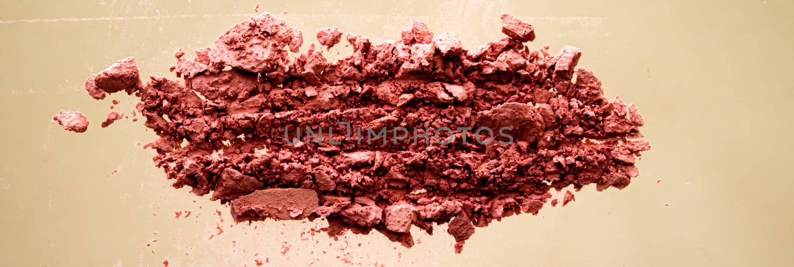 Crushed cosmetics, mineral organic eyeshadow, blush and cosmetic powder isolated on golden background, makeup and beauty banner, flatlay design.